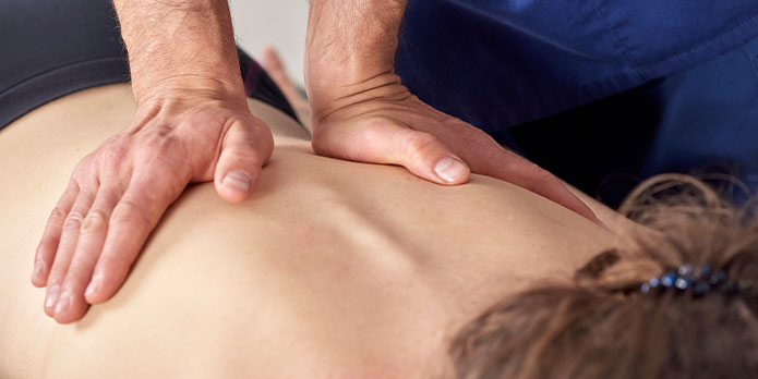 patient getting diversified chiropractic as an auto accident injury treatment in Raleigh